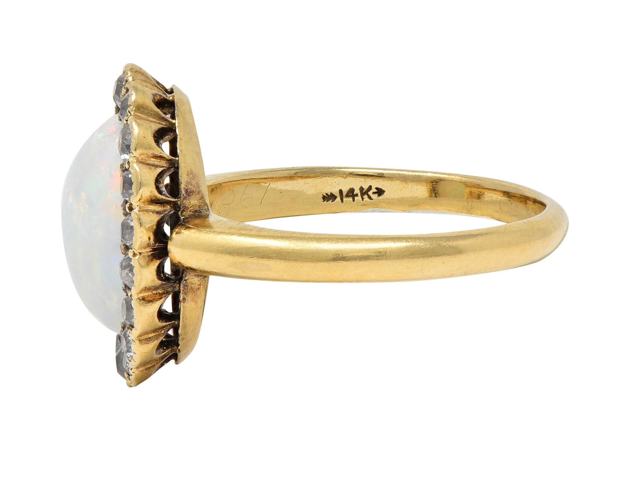 Early 1900's Opal Diamond 14 Karat Yellow Gold Antique Halo Ring