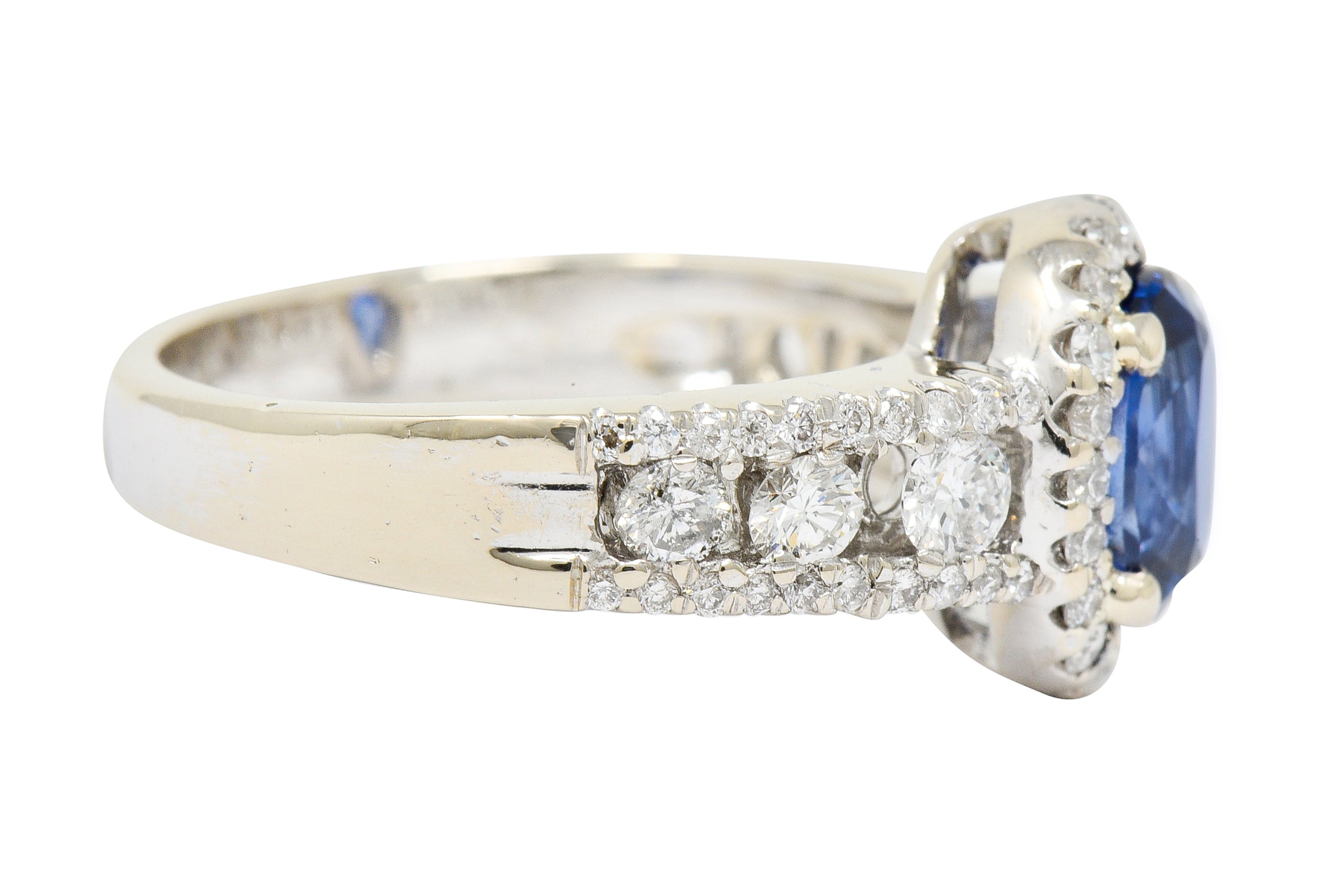 Contemporary 2.31 CTW Sapphire Diamond 18 Karat White Gold Halo Ring - Wilson's Estate Jewelry