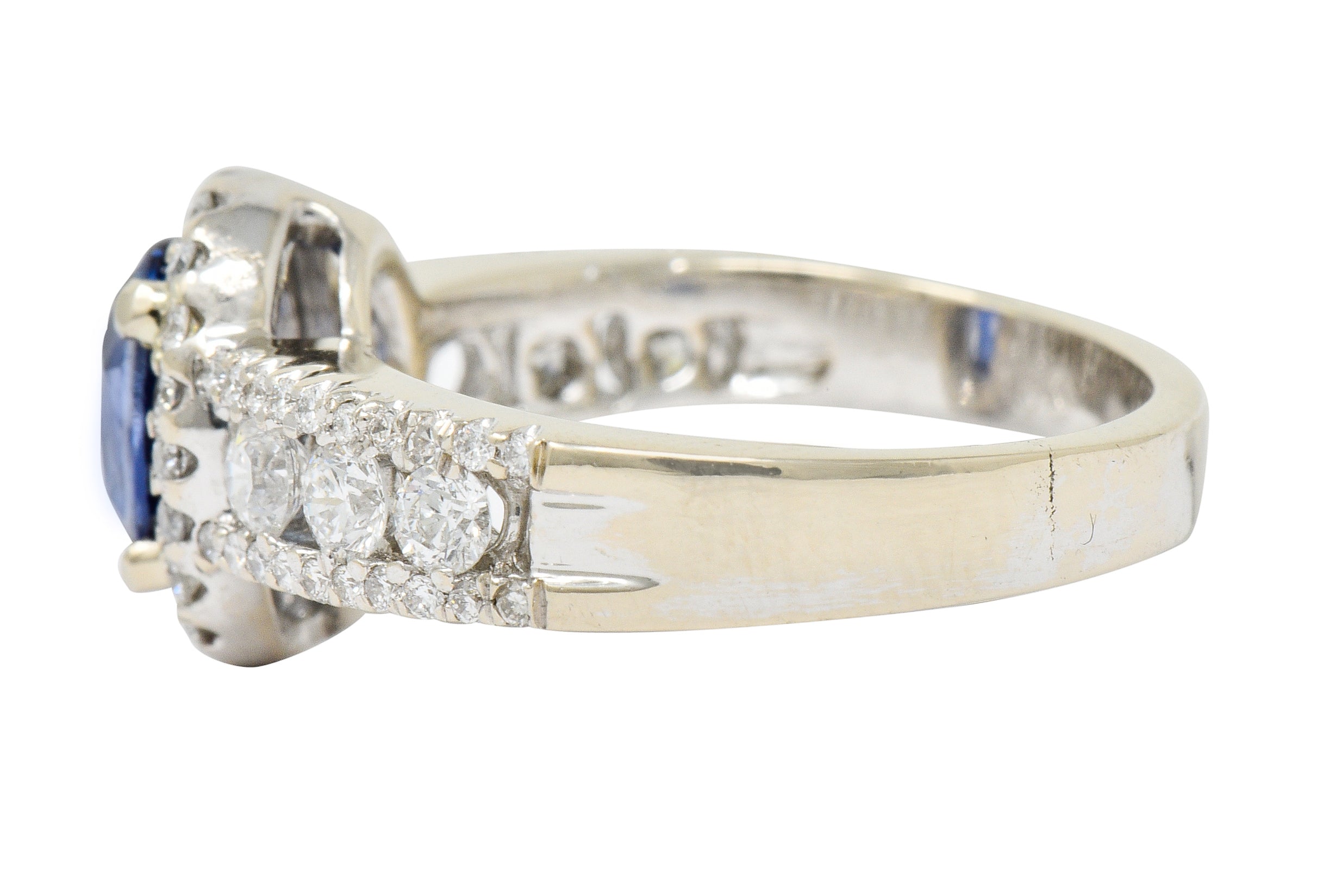 Contemporary 2.31 CTW Sapphire Diamond 18 Karat White Gold Halo Ring - Wilson's Estate Jewelry