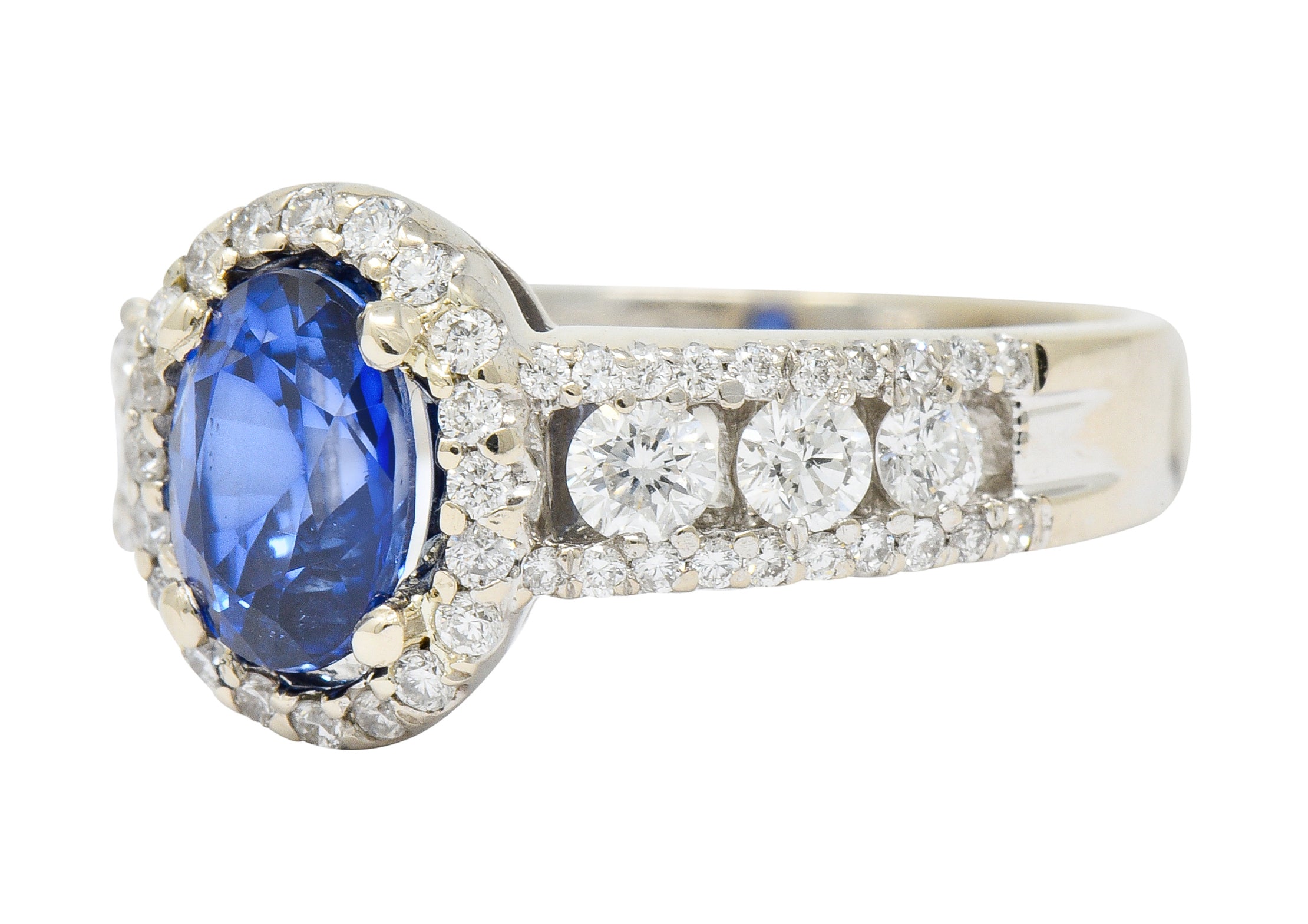 Contemporary 2.31 CTW Sapphire Diamond 18 Karat White Gold Halo Ring - Wilson's Estate Jewelry