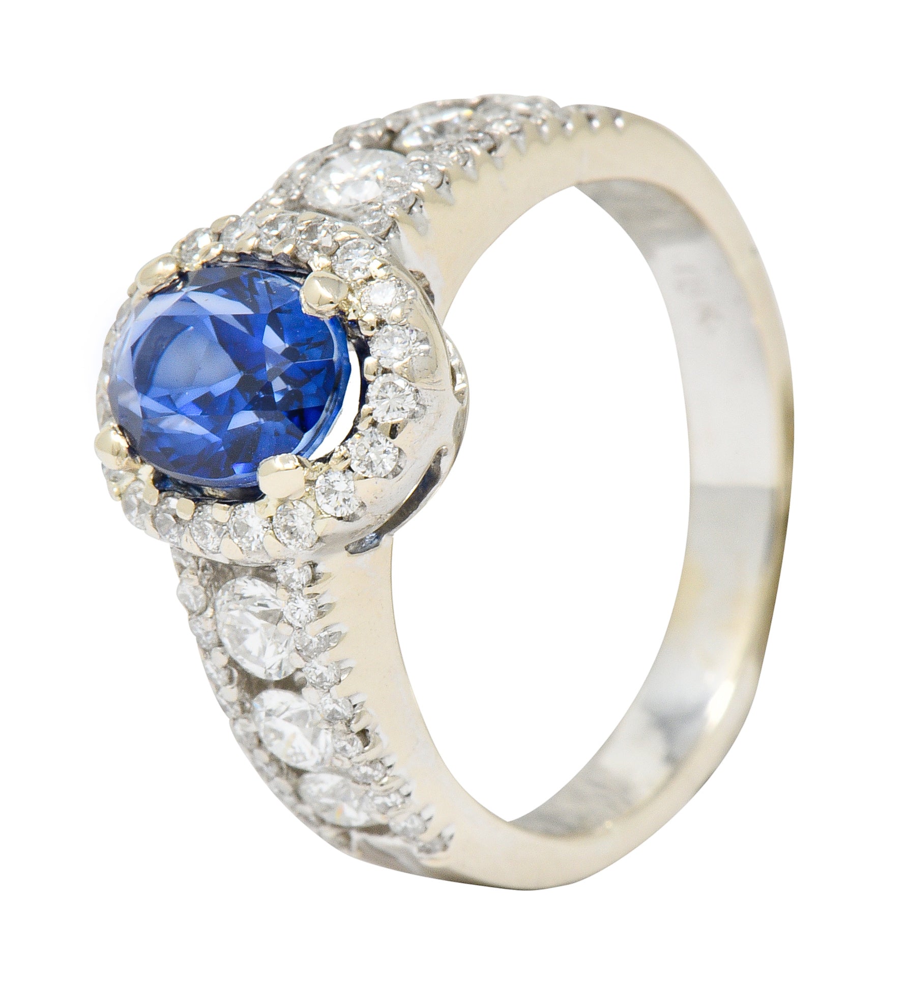 Contemporary 2.31 CTW Sapphire Diamond 18 Karat White Gold Halo Ring - Wilson's Estate Jewelry