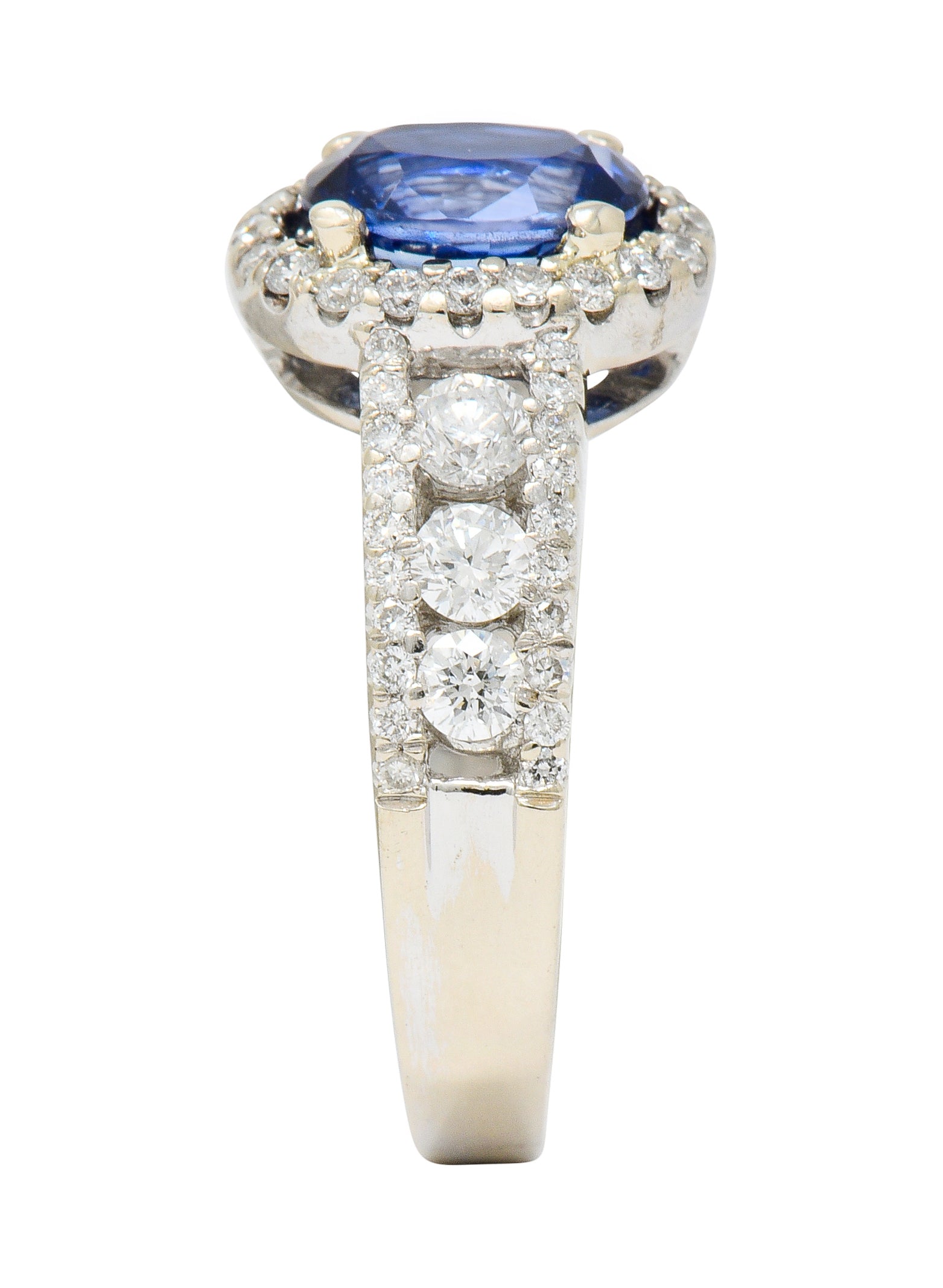 Contemporary 2.31 CTW Sapphire Diamond 18 Karat White Gold Halo Ring - Wilson's Estate Jewelry
