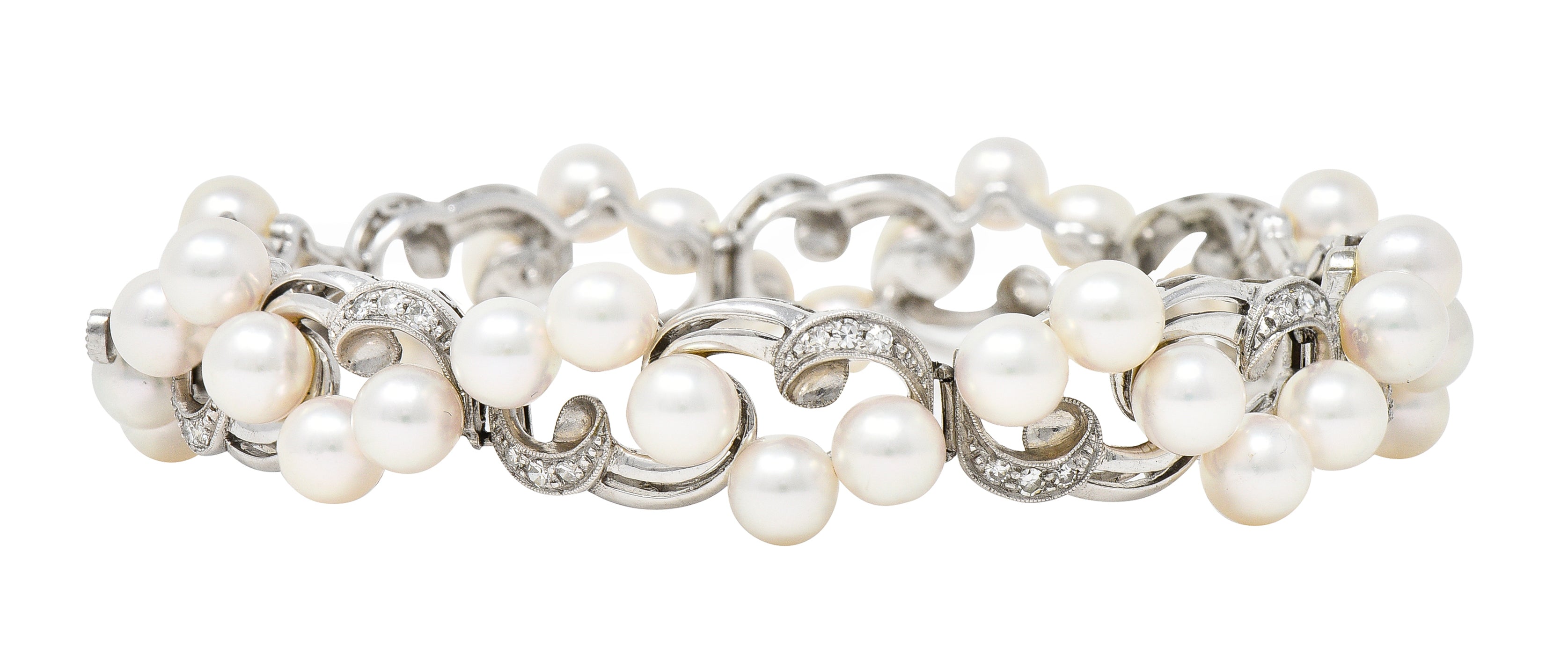 Mikimoto Mid-Century Diamond Cultured Pearl 14 Karat White Gold Scrolling Ribbon Vintage Bracelet Wilson's Estate Jewelry