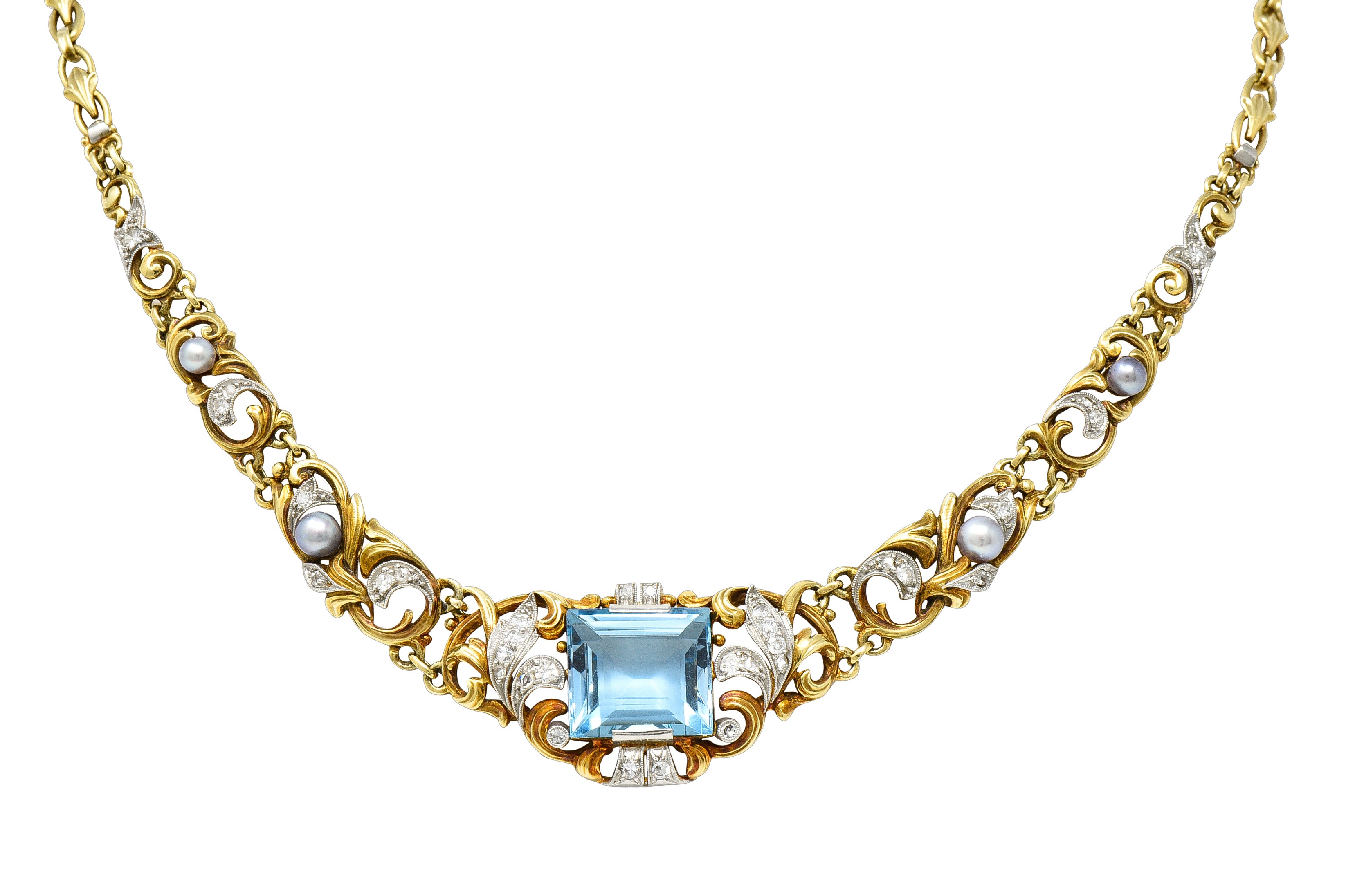 Edwardian 9.71 CTW Step-Cut Aquamarine Diamond Pearl Platinum 14 Karat Yellow Gold Fleur-De-Lis Antique Station Necklace Wilson's Estate Jewelry