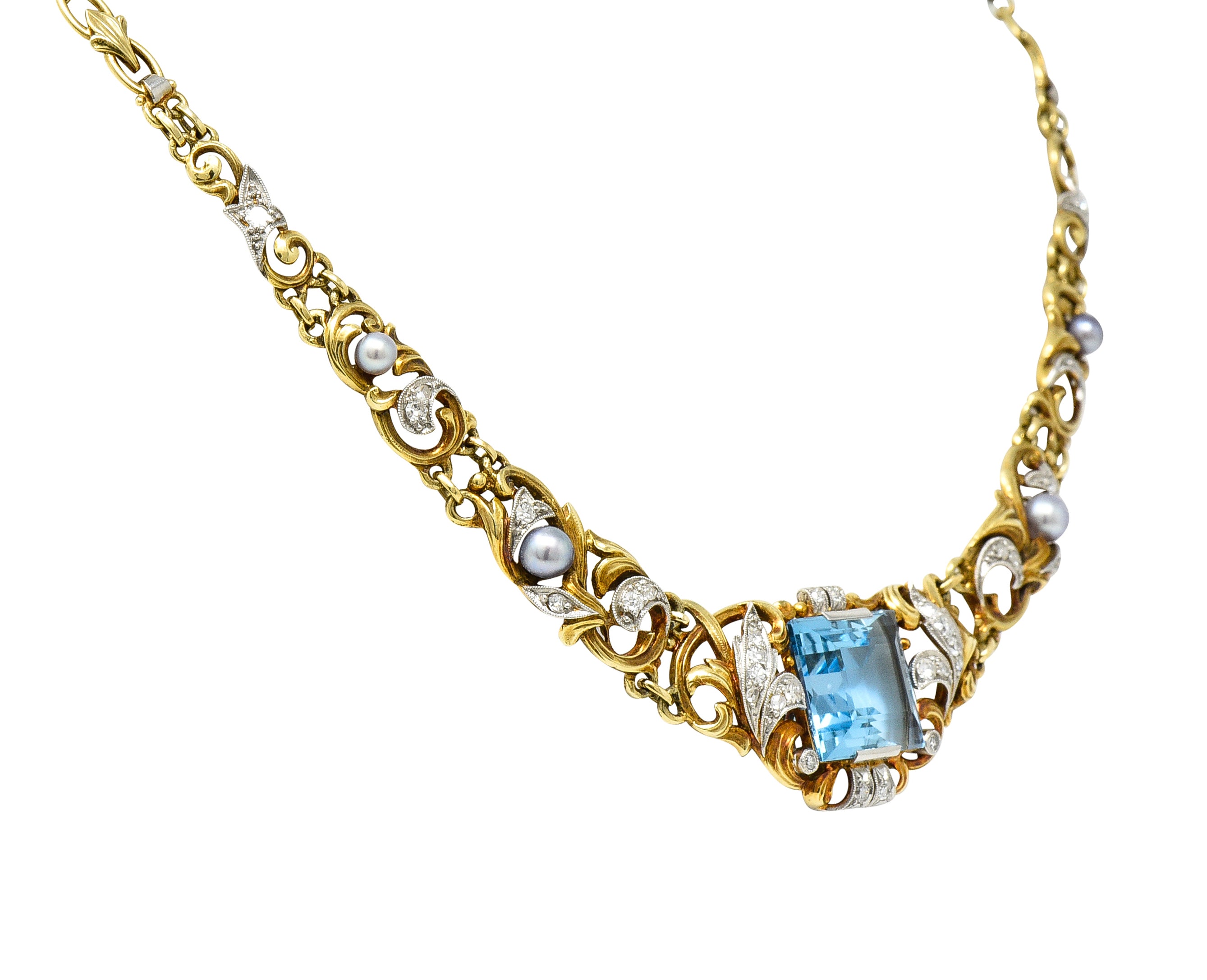 Edwardian 9.71 CTW Step-Cut Aquamarine Diamond Pearl Platinum 14 Karat Yellow Gold Fleur-De-Lis Antique Station Necklace Wilson's Estate Jewelry