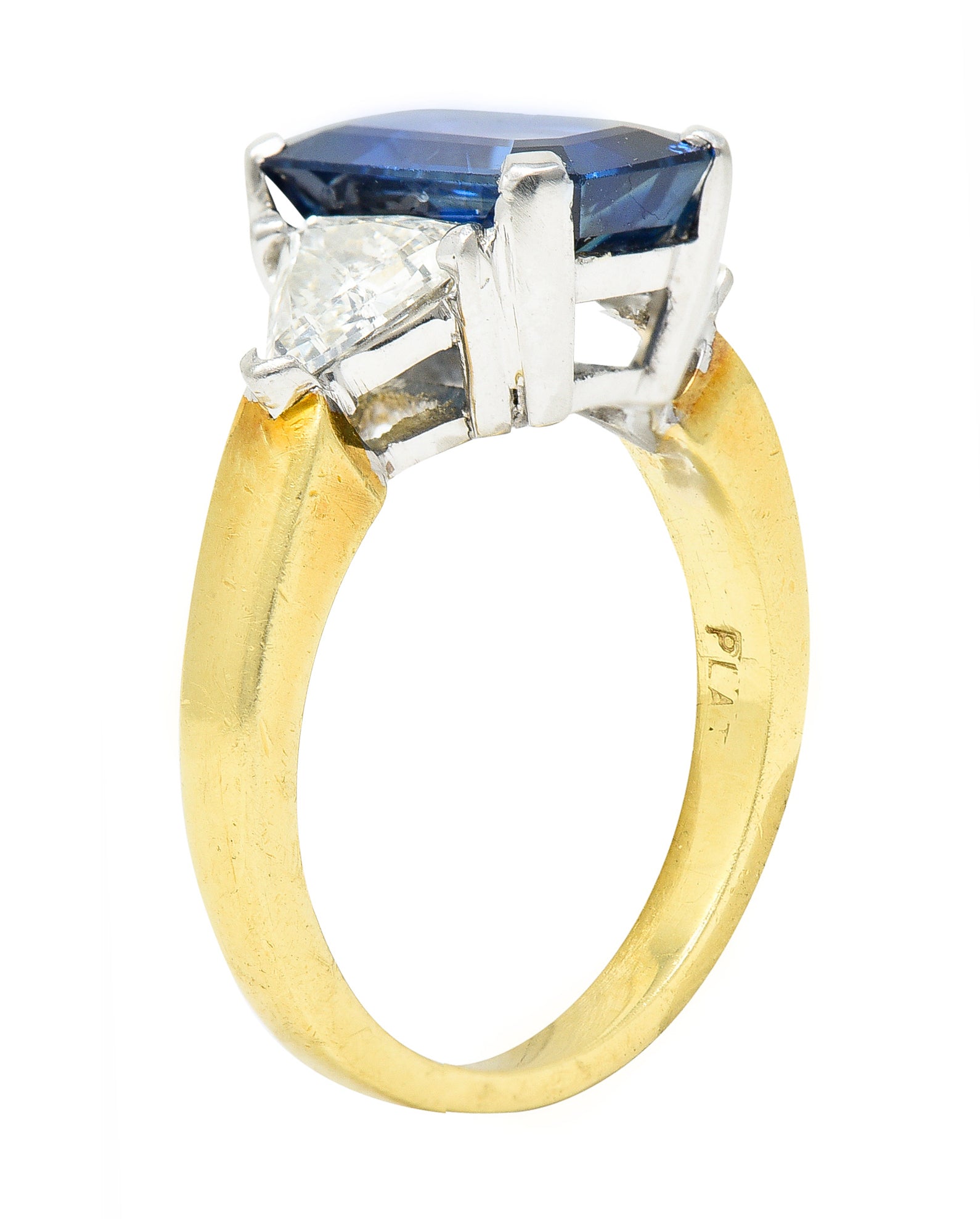 .11111 ## IS THIS A BETTER EDIT?SL 1980's 4.00 CTW Emerald Cut Sapphire Trillion Cut Diamond Platinum 18 Karat Yellow Gold Vintage Three Stone Ring Wilson's Estate Jewelry