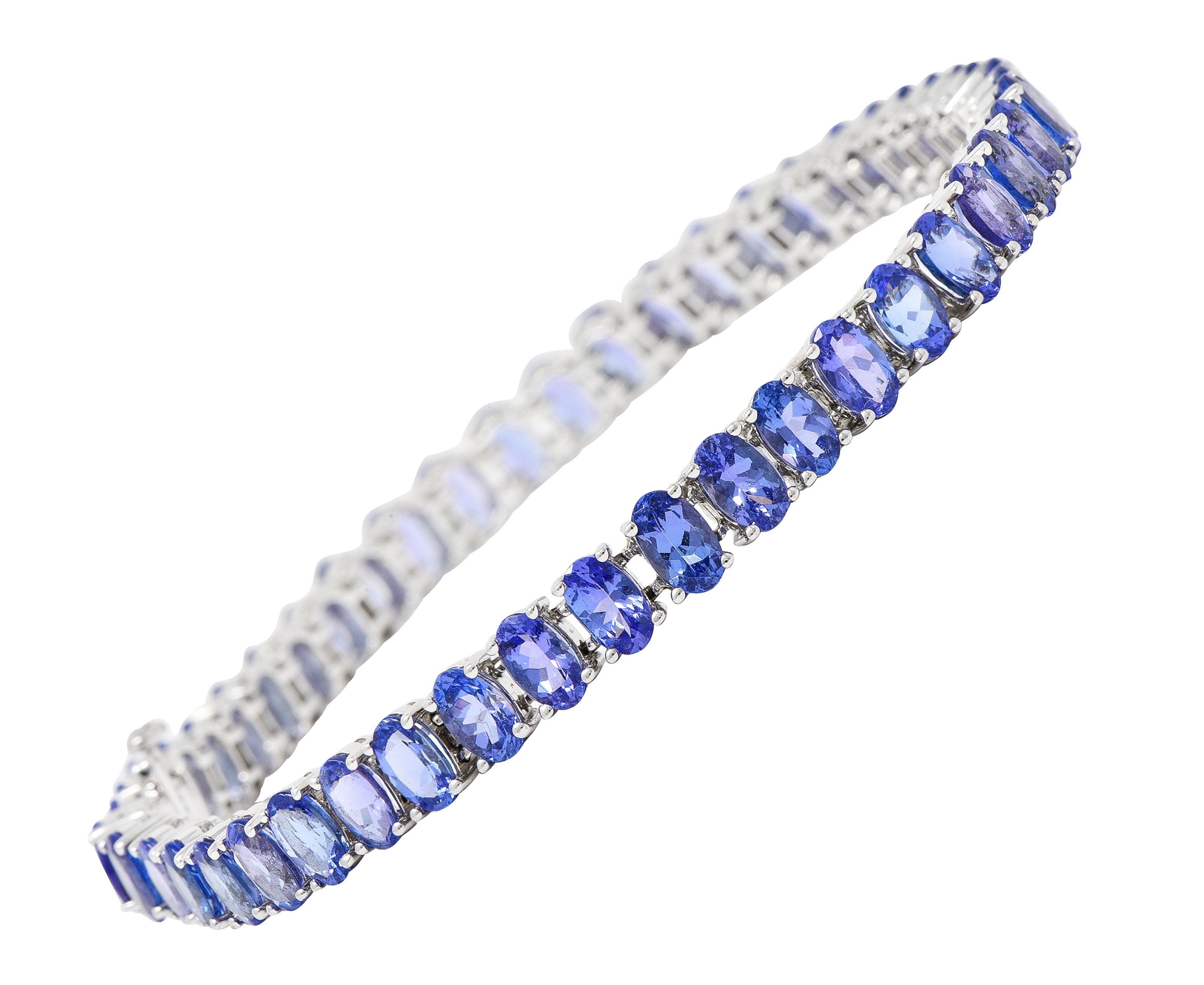 Contemporary 12.00 CTW Oval Cut Tanzanite 14 Karat White Gold Line Bracelet Wilson's Estate Jewelry