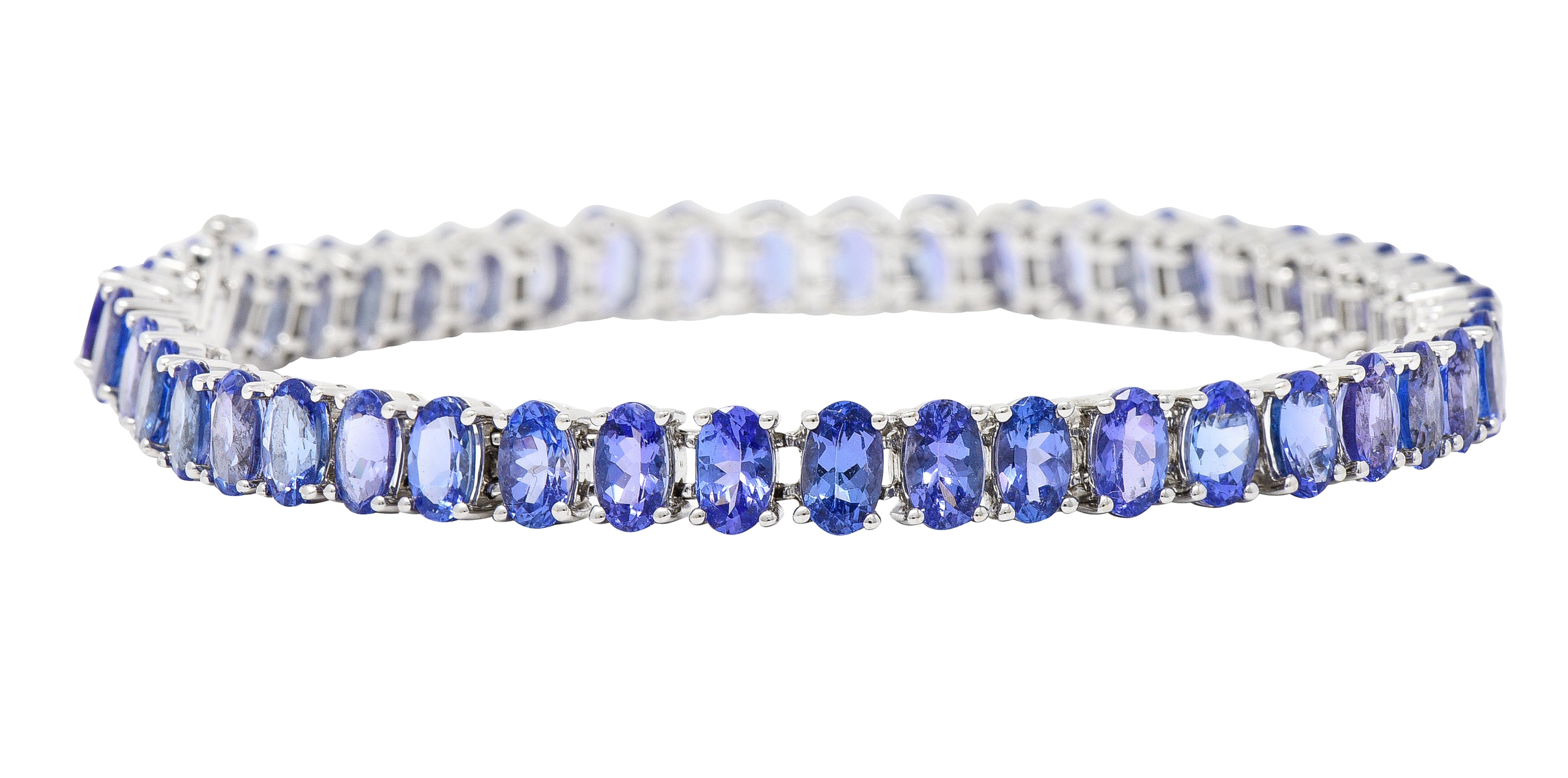 Contemporary 12.00 CTW Oval Cut Tanzanite 14 Karat White Gold Line Bracelet Wilson's Estate Jewelry