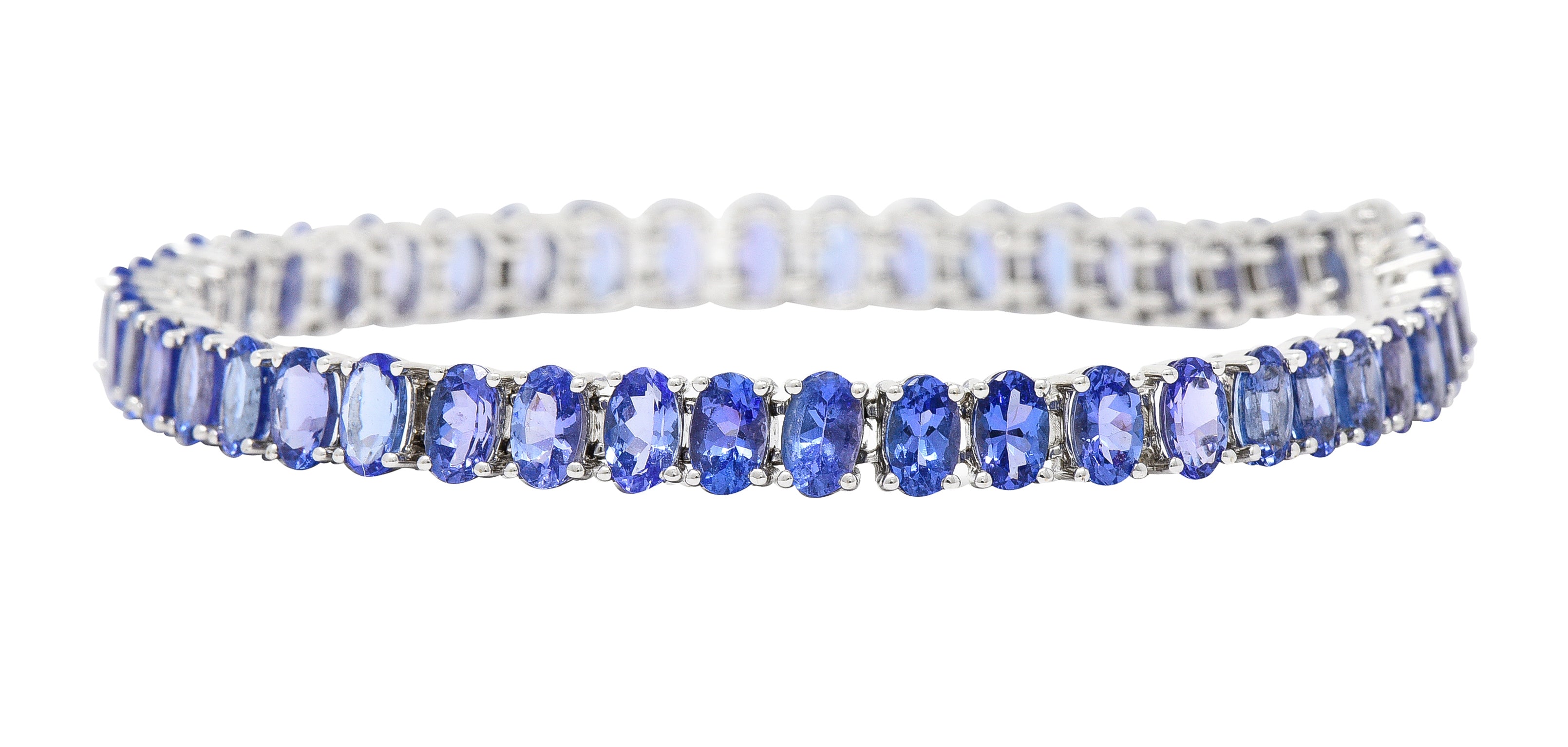 Contemporary 12.00 CTW Oval Cut Tanzanite 14 Karat White Gold Line Bracelet Wilson's Estate Jewelry