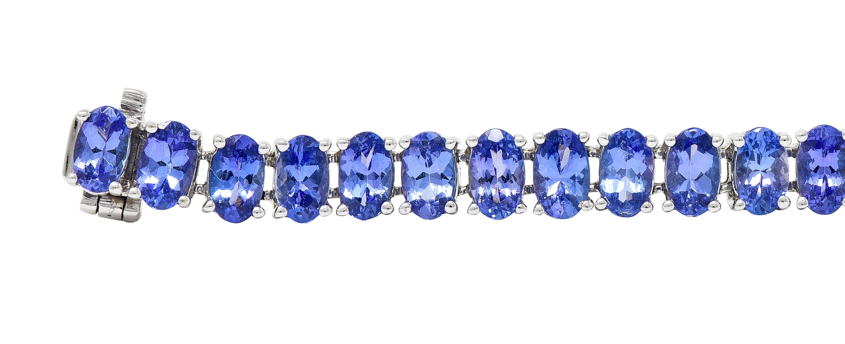 Contemporary 12.00 CTW Oval Cut Tanzanite 14 Karat White Gold Line Bracelet Wilson's Estate Jewelry