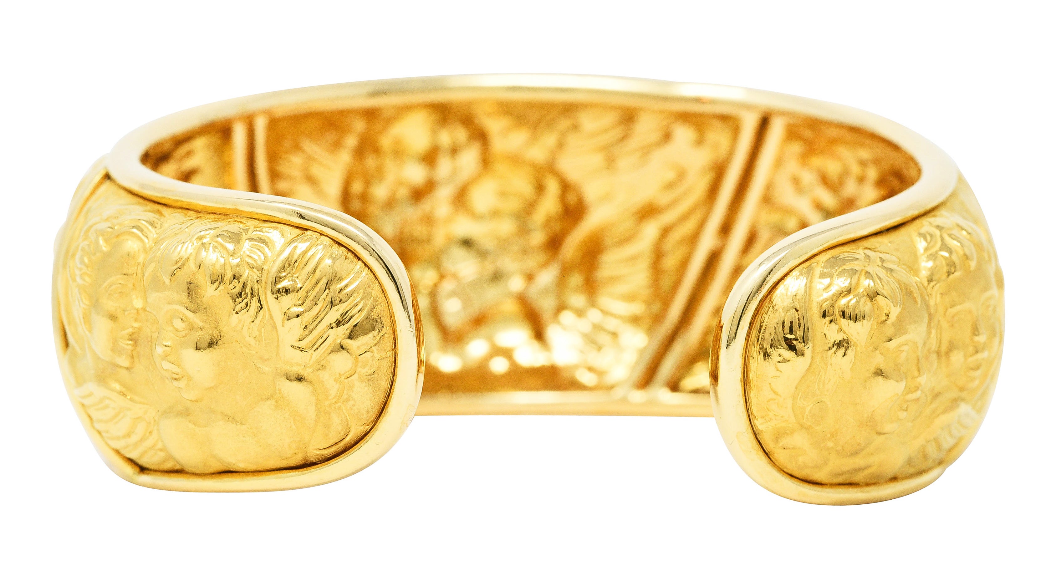 Carrera y Carrera 1990's 18 Karat Yellow Gold Repoussé Cherub Vintage Cuff Bracelet Wilson's Estate Jewelry