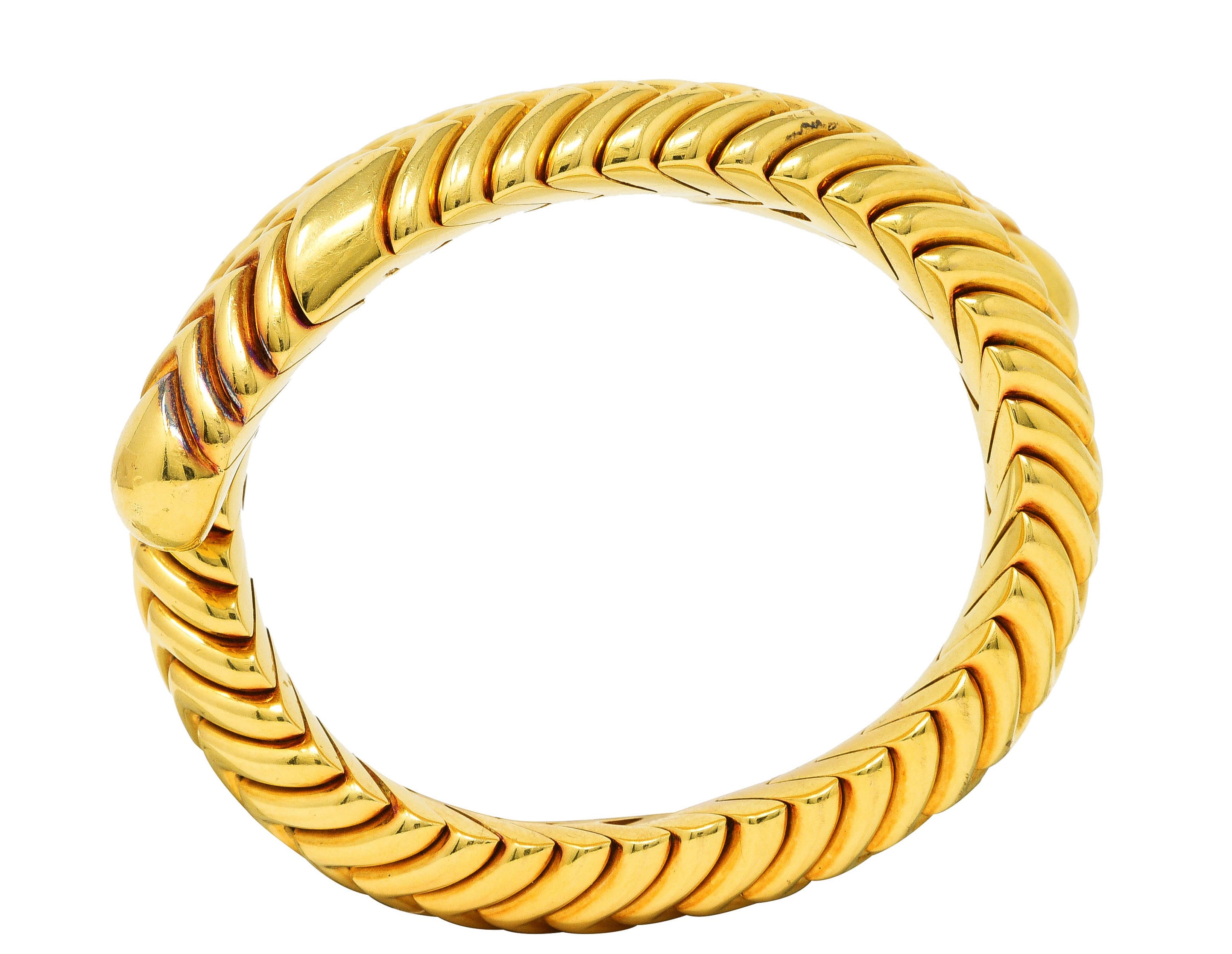 Bulgari 1990's 18 Karat Yellow Gold Chevron Spiga Wrap Vintage Bangle Bracelet Wilson's Estate Jewelry