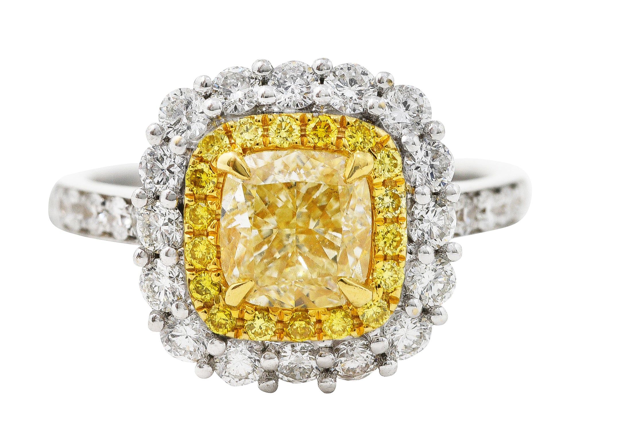 Contemporary 2.16 CTW Cushion Cut Fancy Yellow Diamond Two-Tone 18 Karat Gold Double Halo Gemstone Ring Wilson's Estate Jewelry