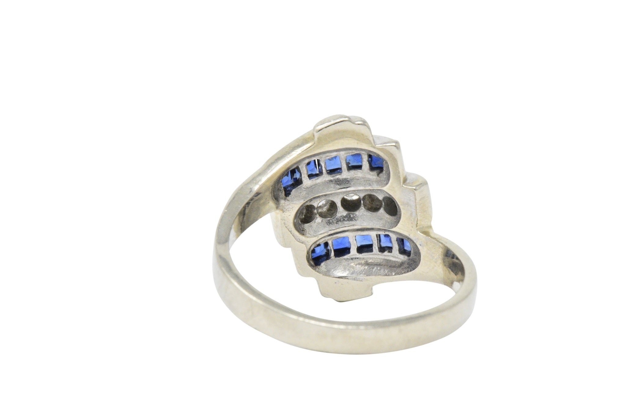 Retro 0.80 CTW Diamond Sapphire 14 Karat White Gold Scrolled Bypass Ring Wilson's Estate Jewelry